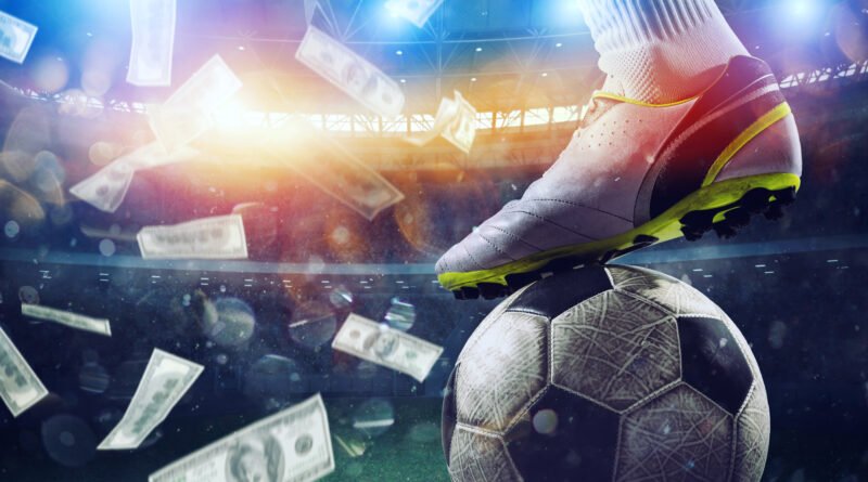 Billetes cayendo sobre un estadio de fútbol que ilustran los premios de la FIFA