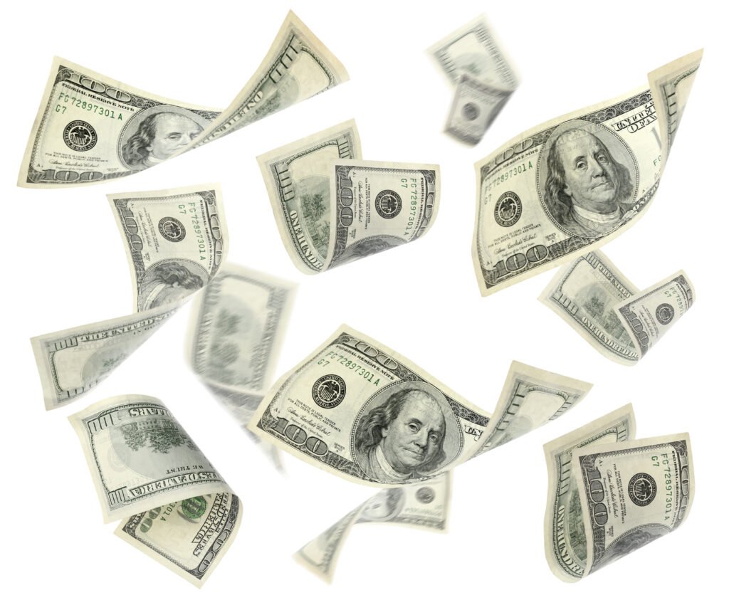 dólar hoy: billetes de cien dólares estadounidenses volando