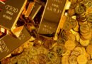 reservas del Banco Central: lingotes de oro sobre una pila de monedas doradas
