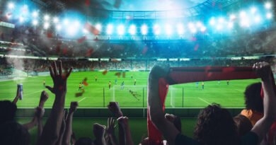 clásico rosarino: estadio de fútbol de noche con la hinchada