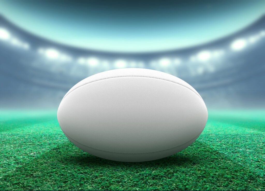 Los Pumas: pelota de rugby en un estadio iluminado