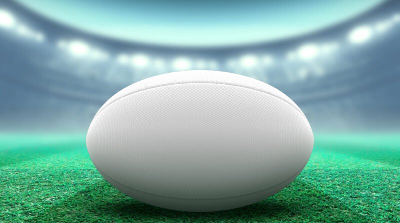 Los Pumas: pelota de rugby en un estadio iluminado