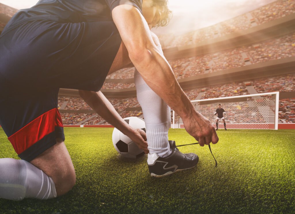 Racing y Boca: futbolista preparándose para patear un penal en el estadio