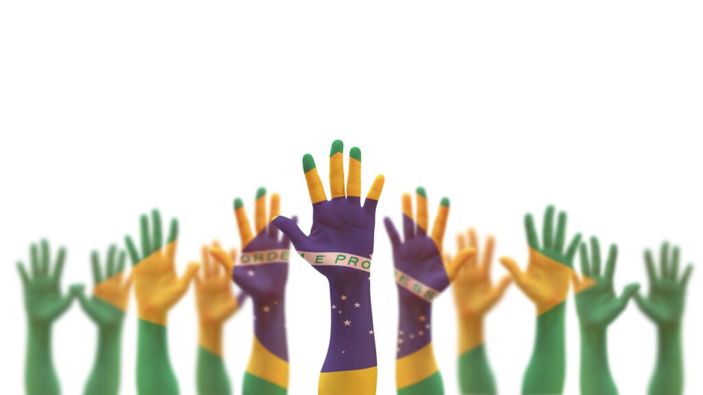 manos con la bandera de Brasil, balotaje en Brasil